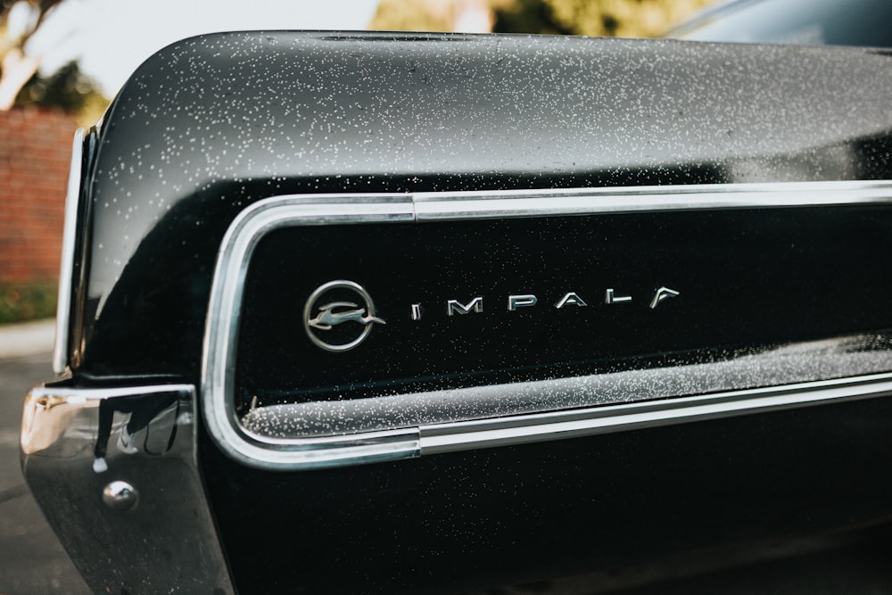 a close up of the emblem on a black car