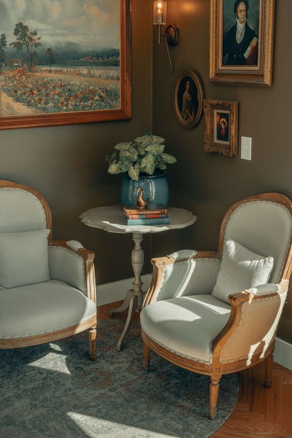 white and brown wooden framed padded armchairs