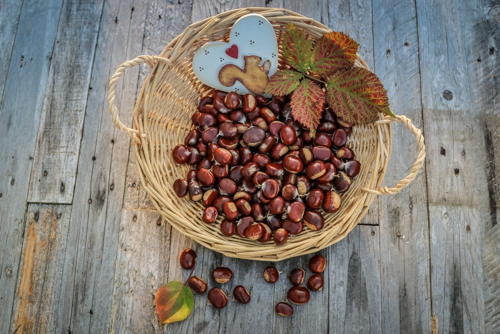 red round fruits on brown woven basket