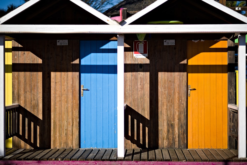 brown wooden door with blue and white striped door