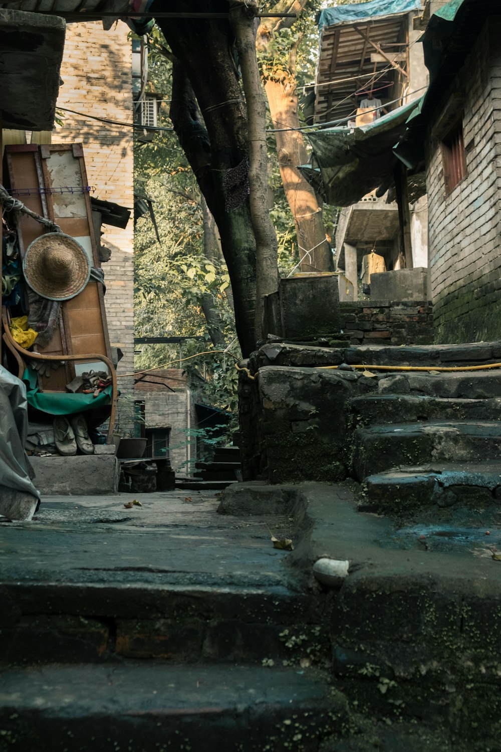 gray concrete stairs with green metal railings