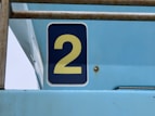 blue and white number 5 sign