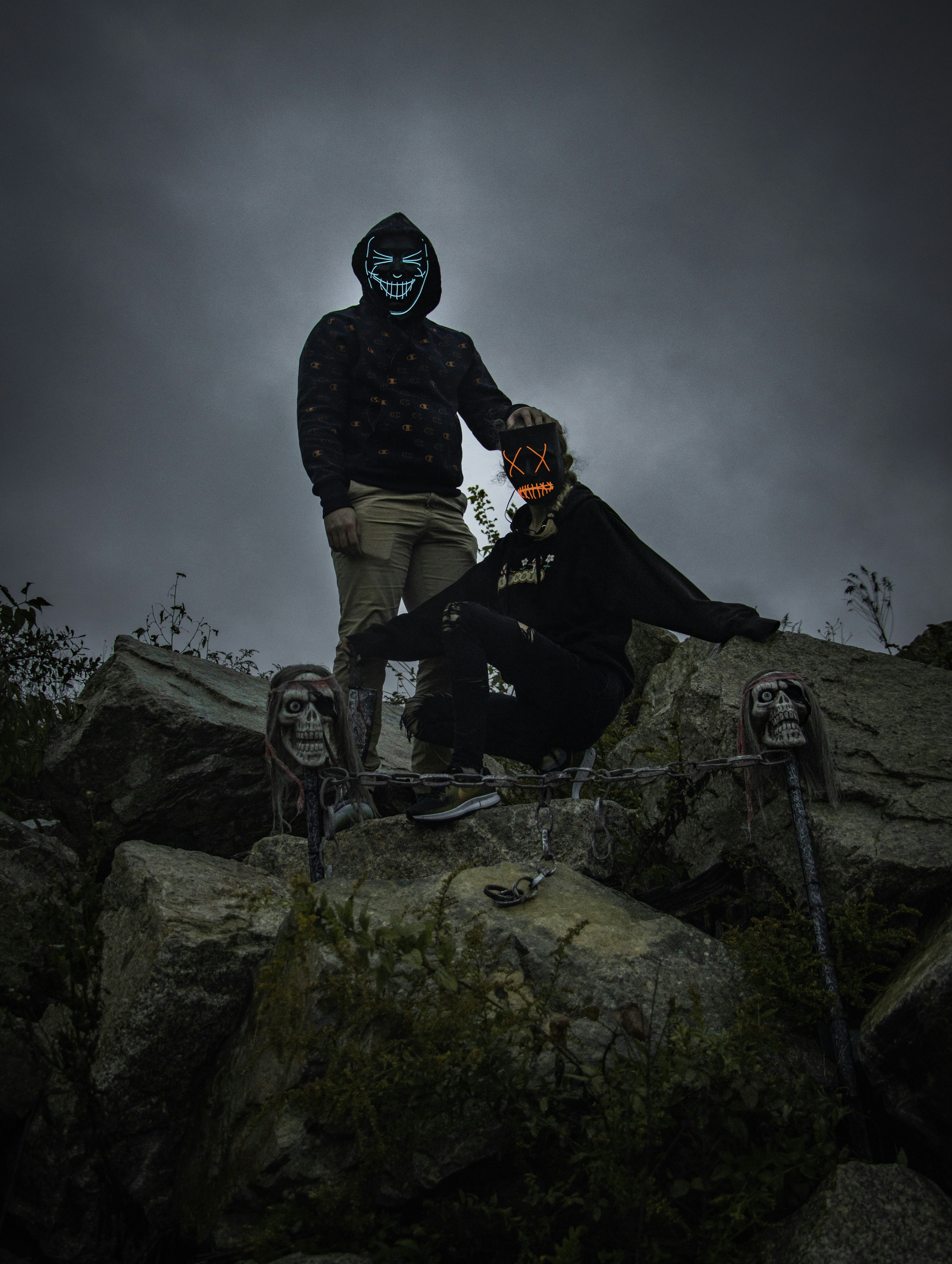 man in black jacket and black pants riding bicycle on rocky mountain during daytime