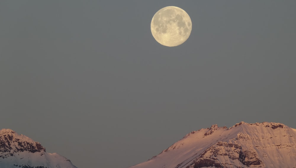 full moon over the mountains