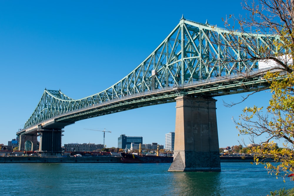 gray bridge over body of water during daytime
