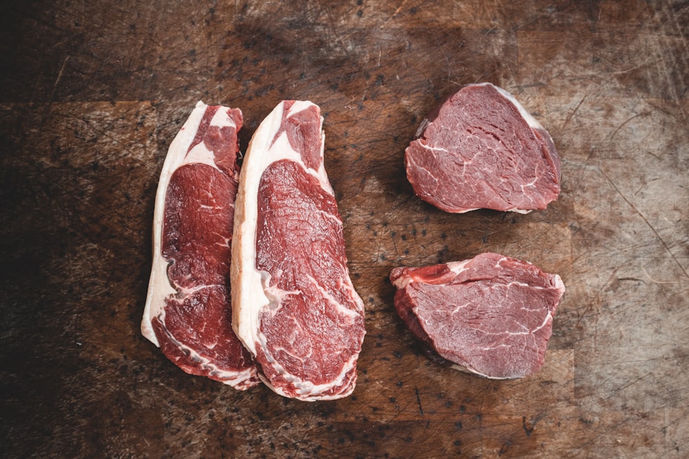 raw meat on brown wooden table