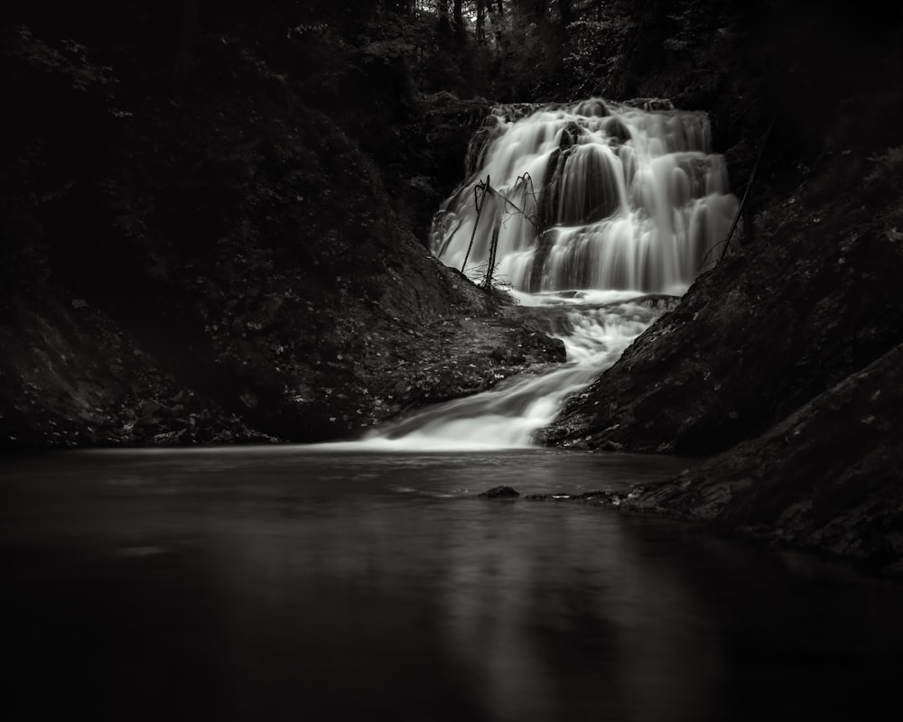 water falls in the middle of the forest