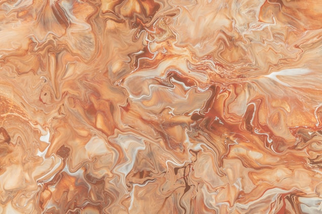 An abstract, fluid art painting featuring swirling patterns and textures. The colors blend seamlessly into each other, creating a marbled effect with various shades.