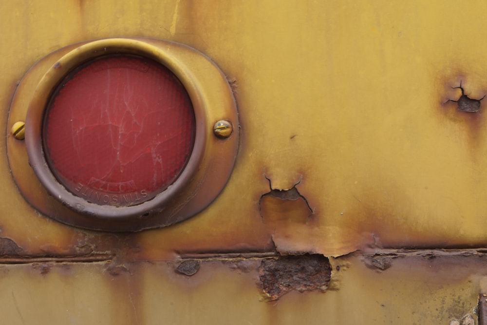 yellow and red round wall mounted mirror