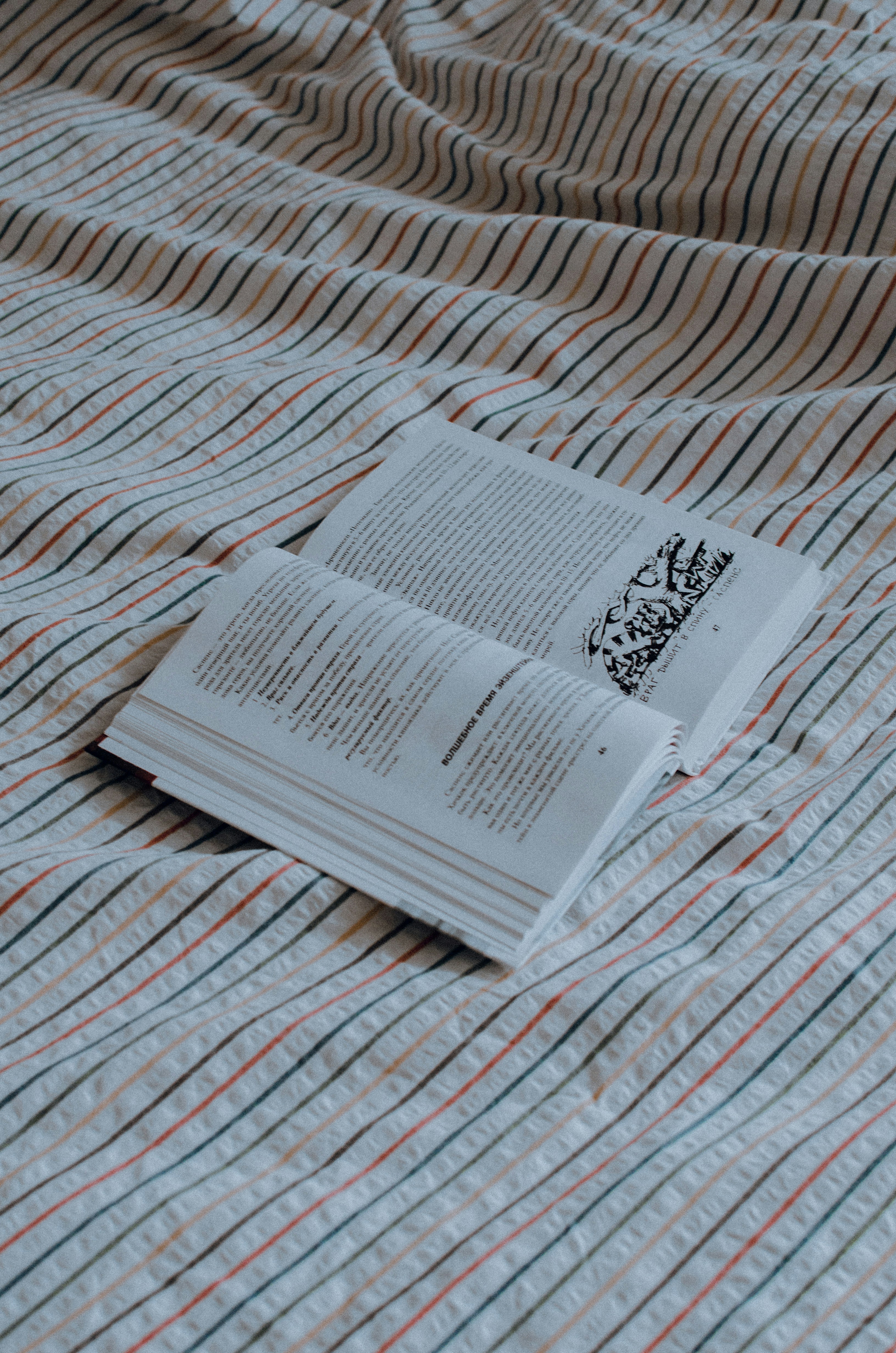 white paper on white and red textile