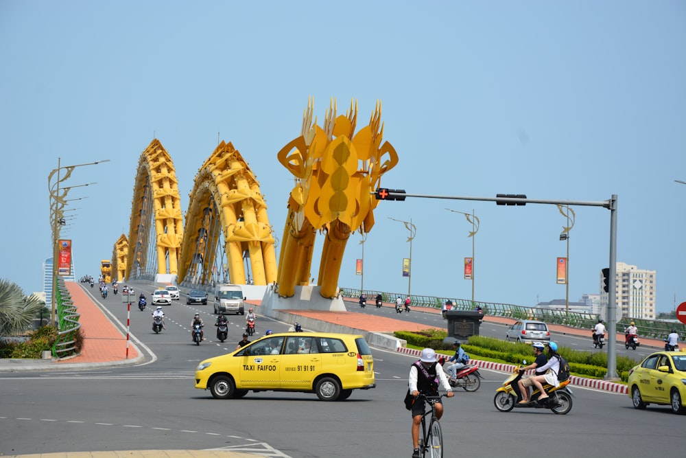 man in black shirt riding bicycle on road during daytime