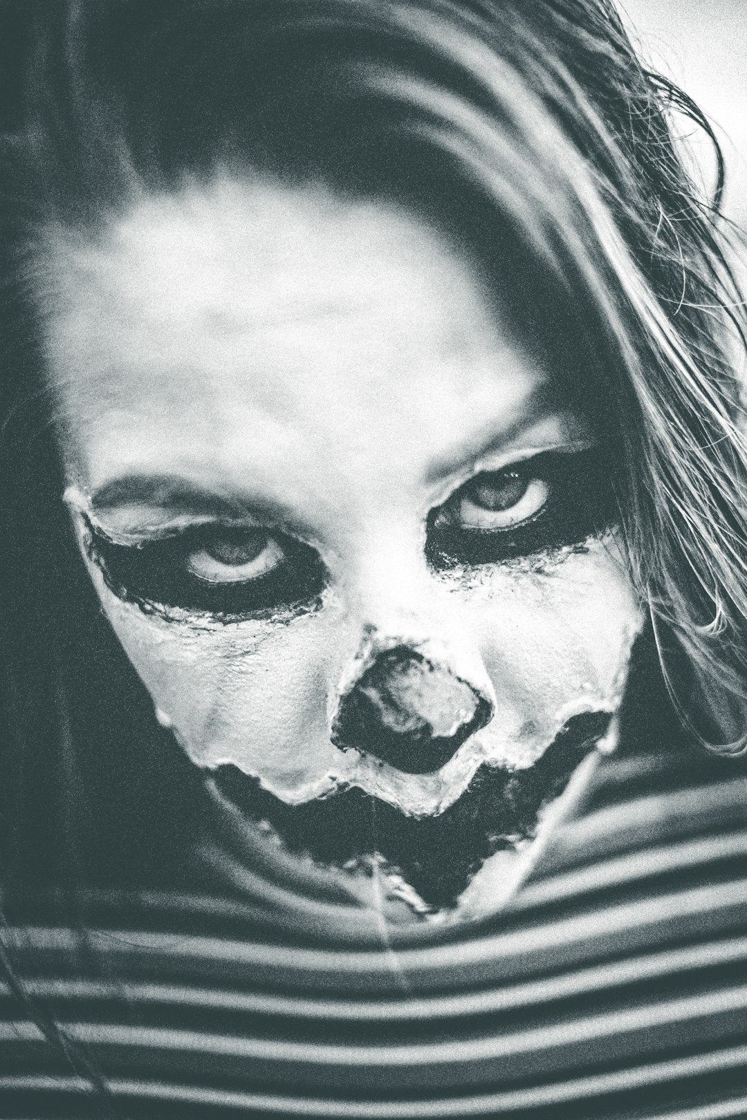 woman with white and black face paint