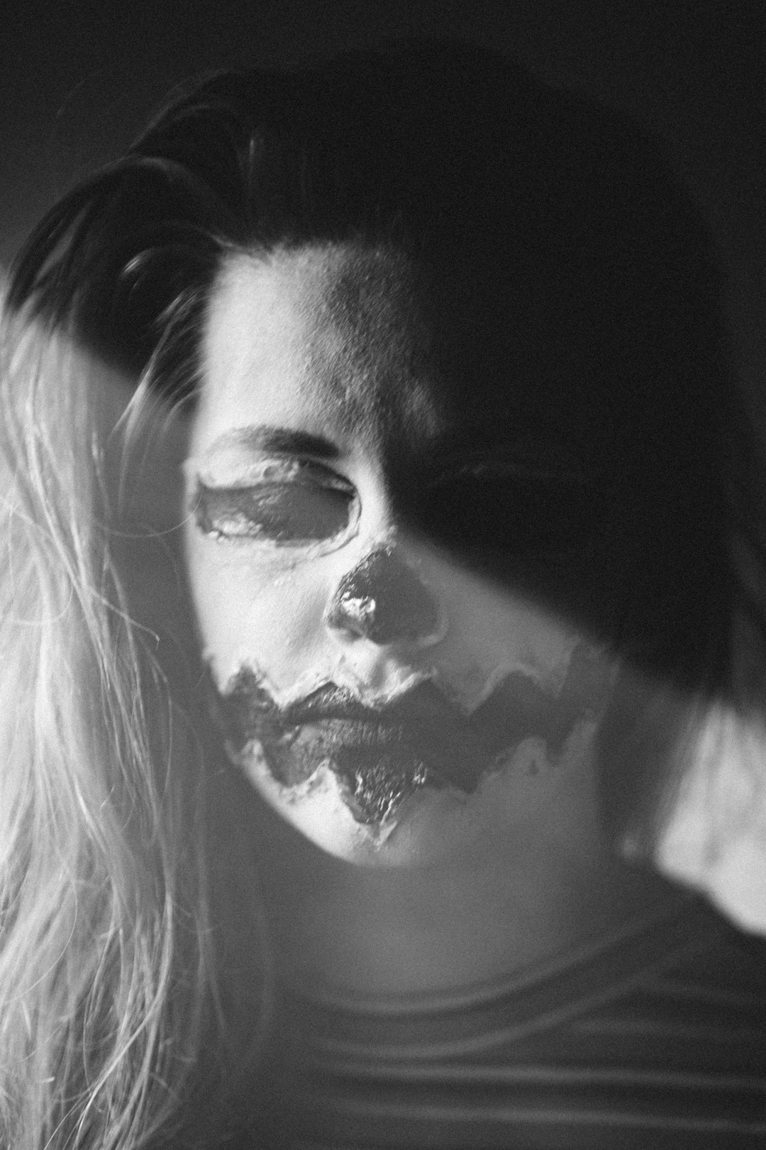 woman with white and black face paint