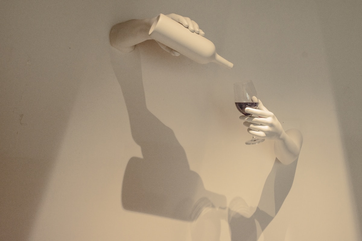 Person holding white plastic cup