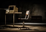 white and black chair beside white table