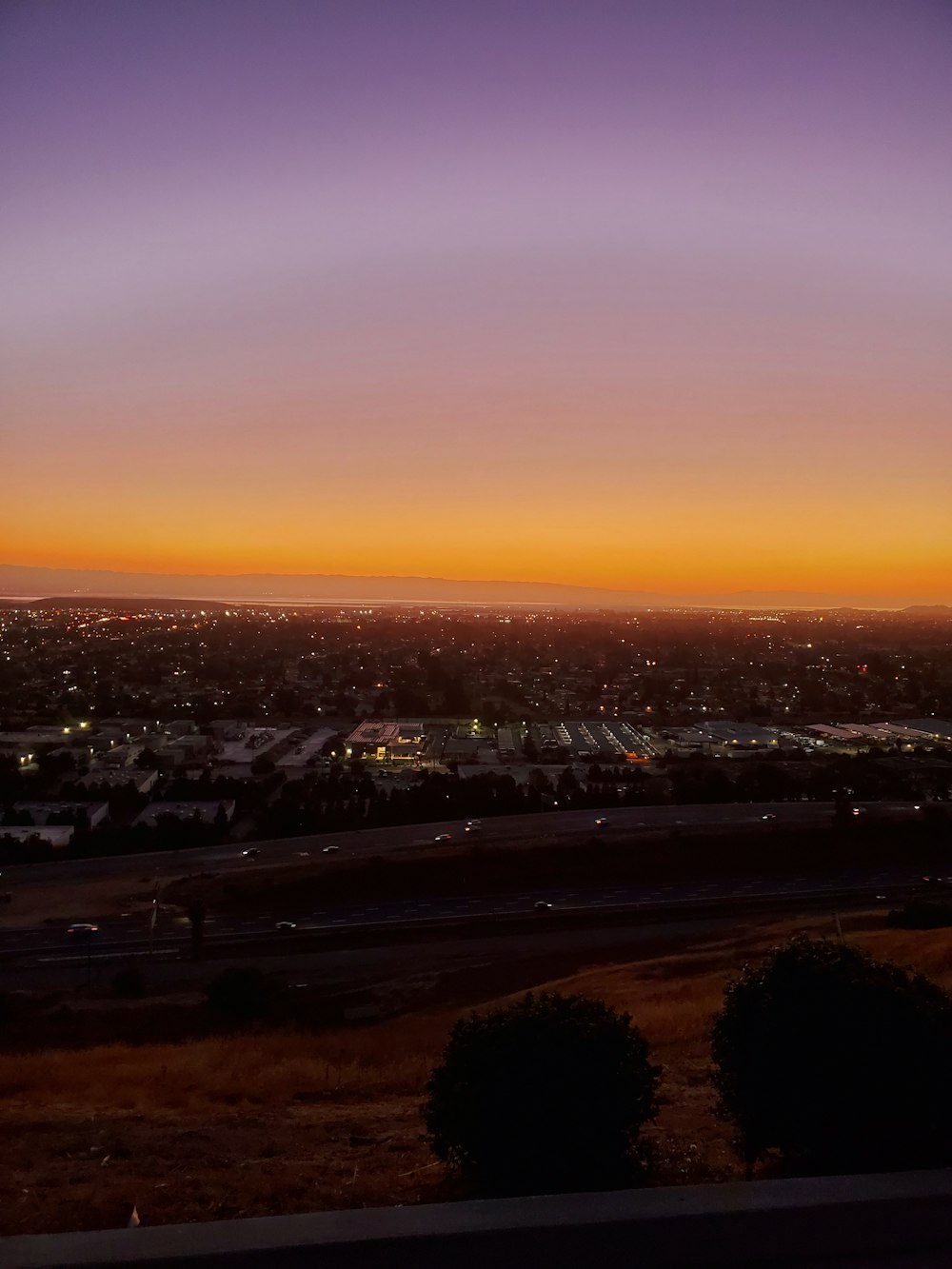 city skyline during sunset with orange sky