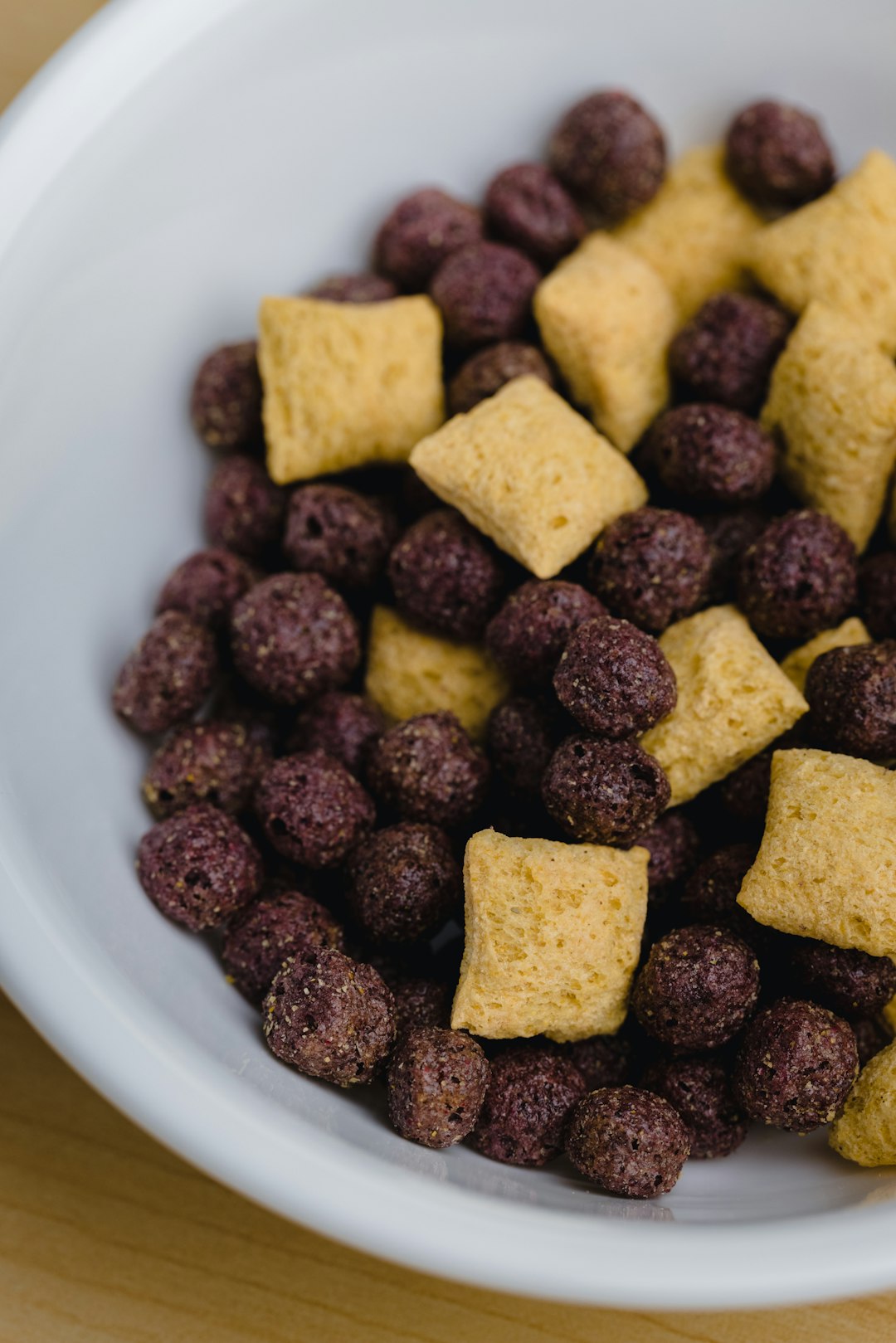 brown and black food on white ceramic bowl