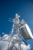 white and gray satellite under blue sky during daytime