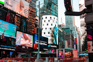 Close-up of a digital billboard displaying a colorful advertisement in an urban setting.