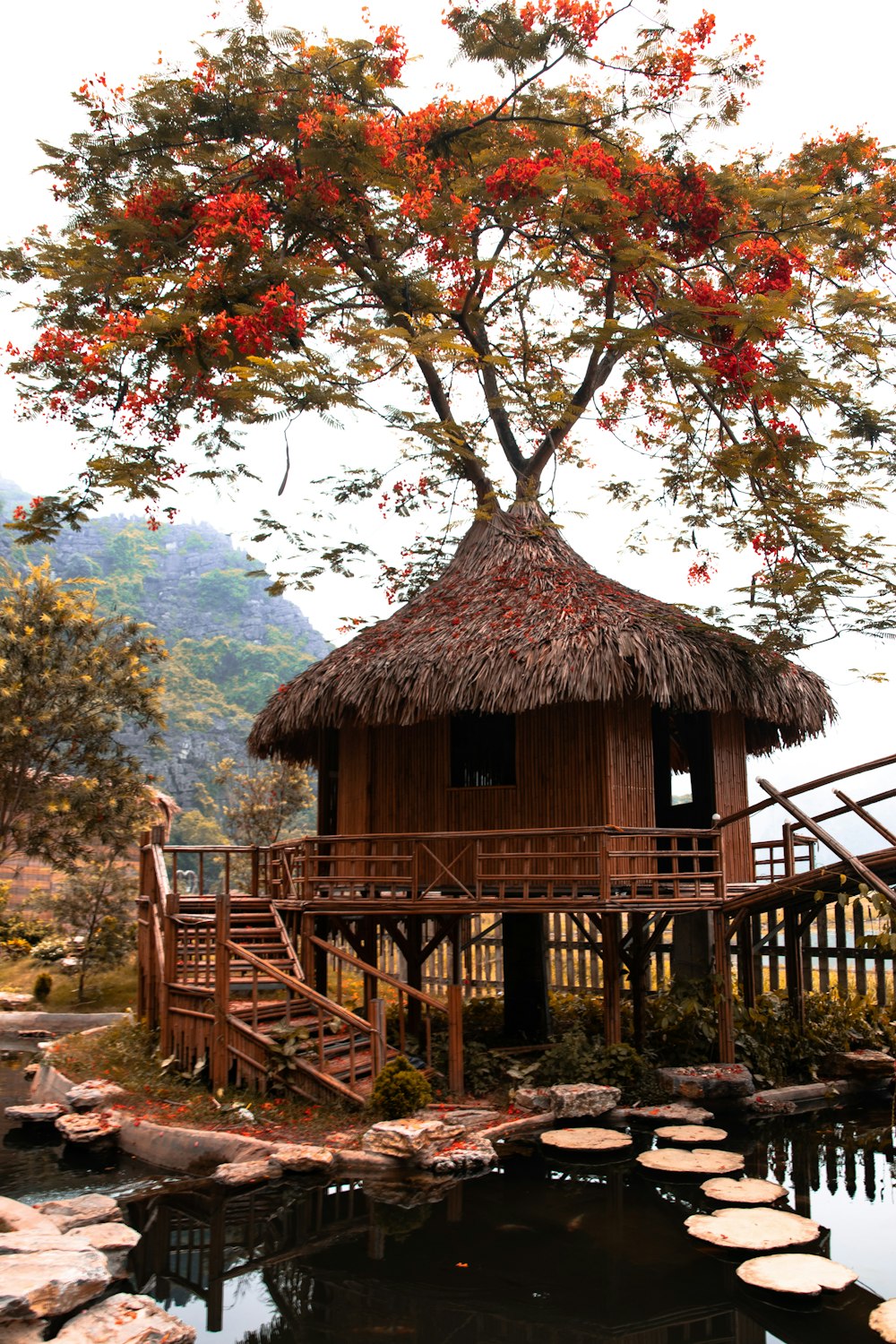 brown wooden house near green trees during daytime