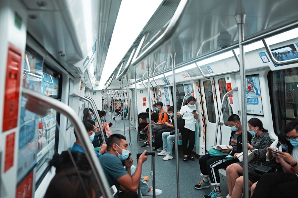 people sitting inside train during daytime