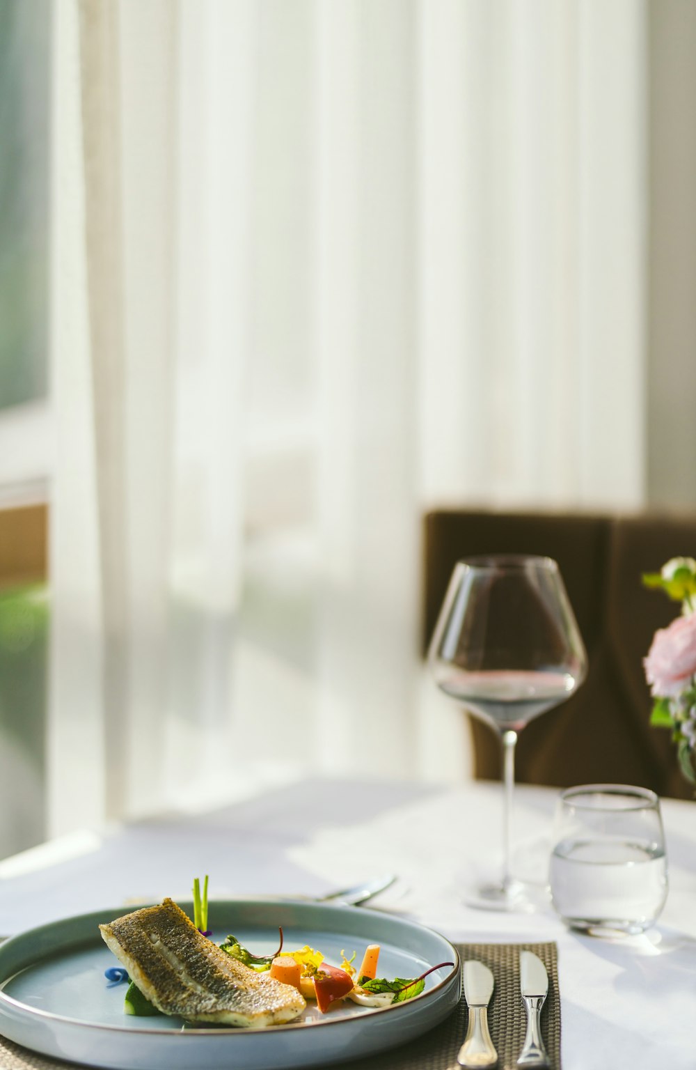 clear wine glass on white table