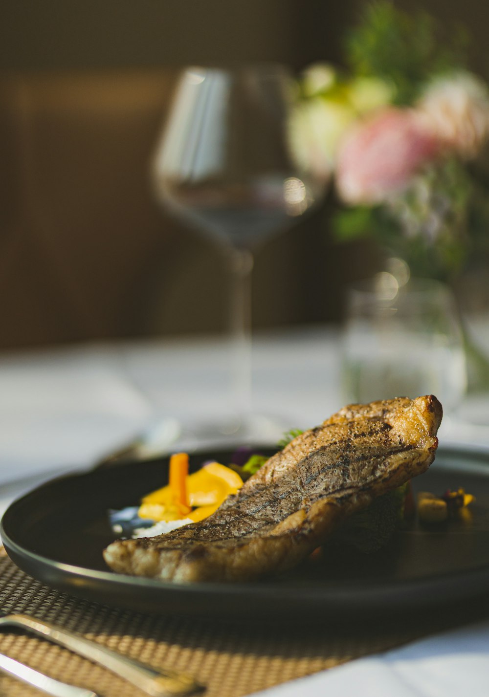 grilled meat on black ceramic plate