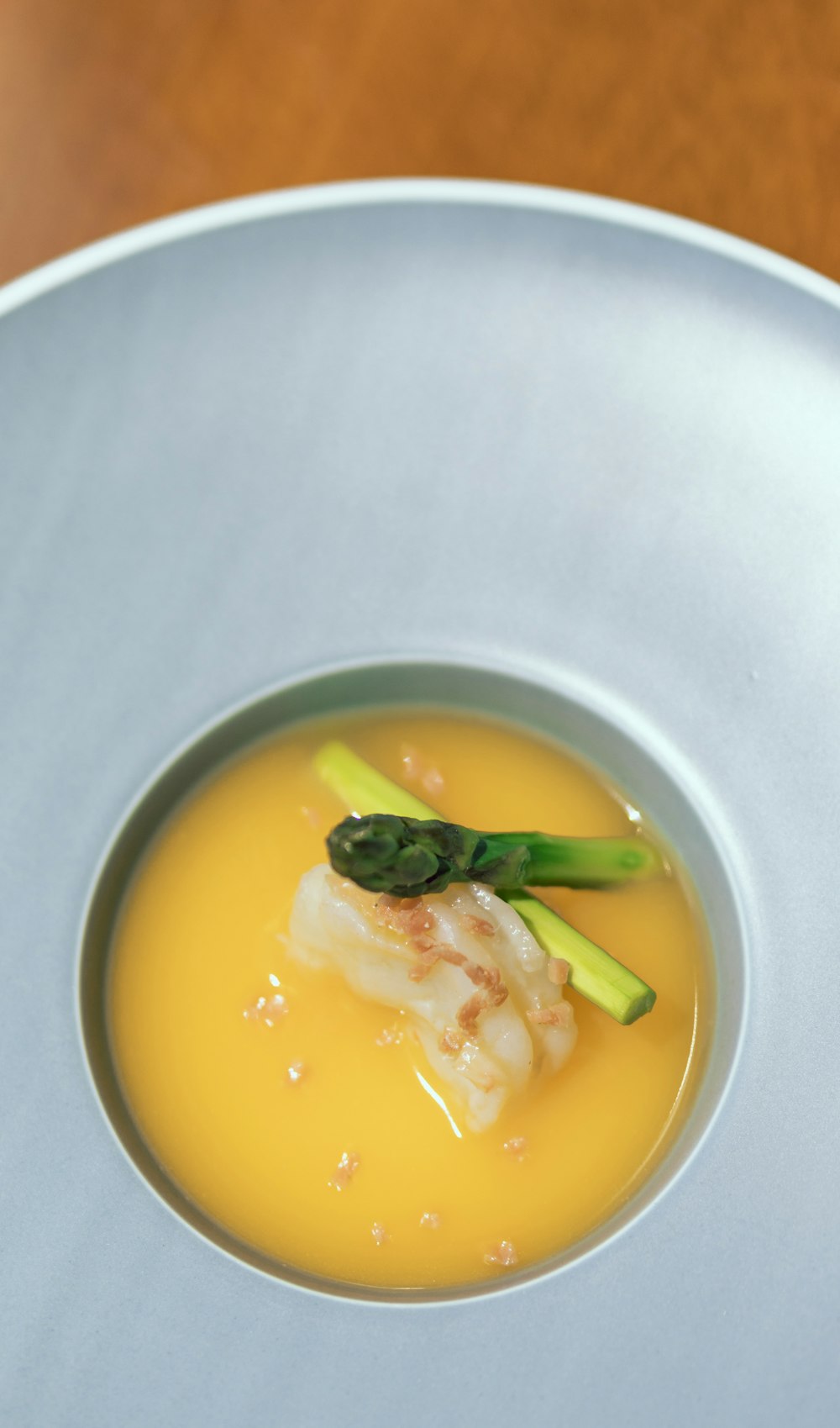 soup with green vegetable on white ceramic bowl