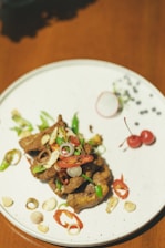 A colorful plate featuring fiery green chili peppers alongside traditional accompaniments.