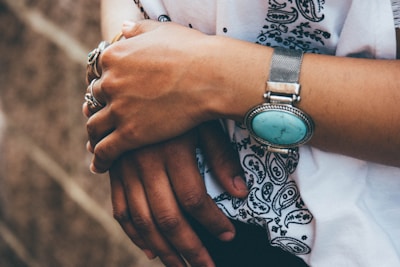 Close-up of hands clapping rhythmically, adorned with traditional flamenco bracelets.
