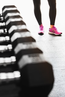 person in pink nike sneakers