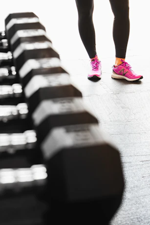 person in pink nike sneakers