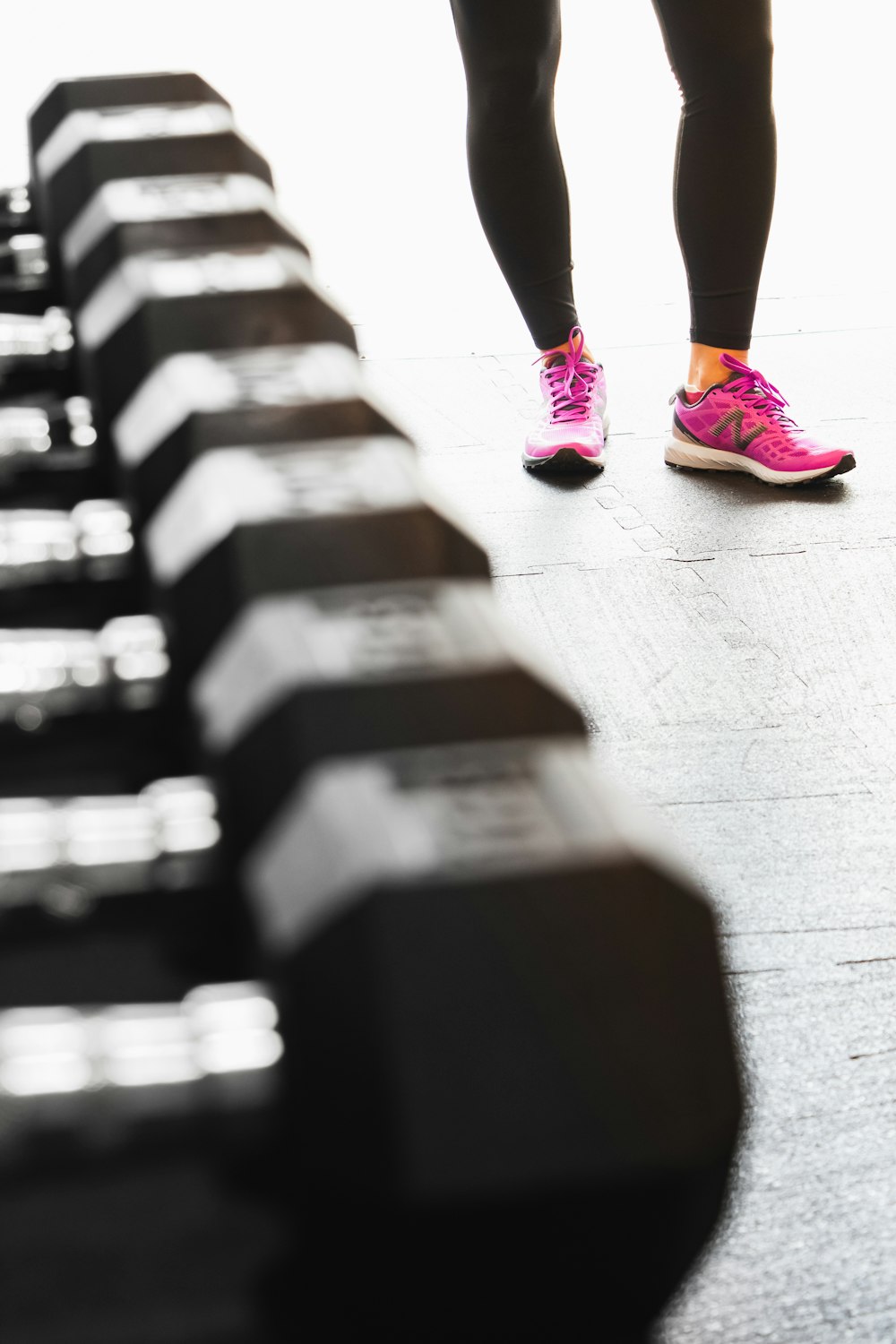 person in pink nike sneakers