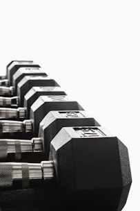 black and silver dumbbells on white background