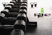 black and gray dumbbells on floor