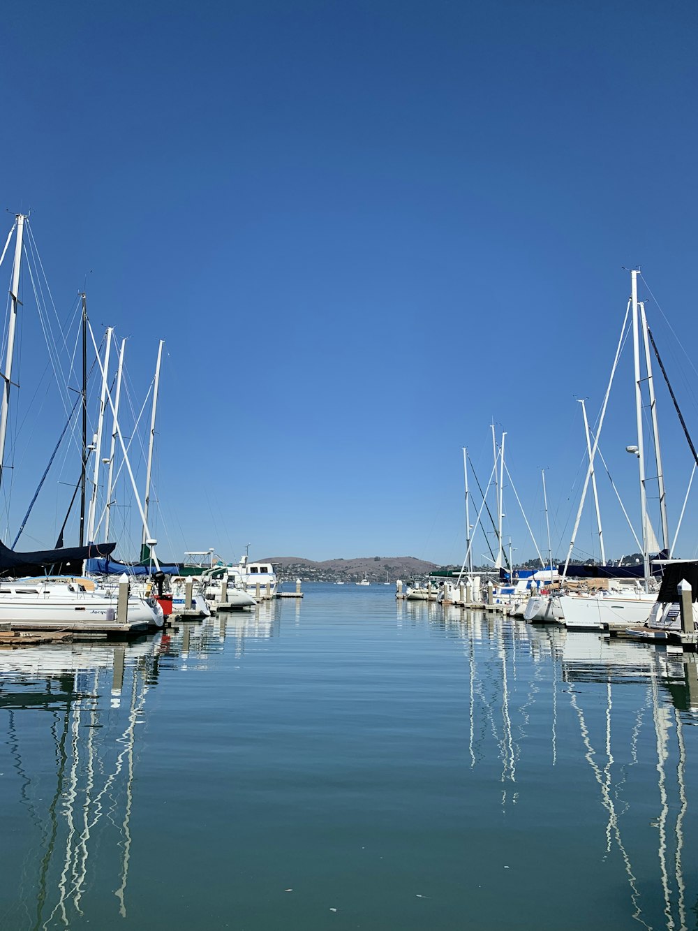 white and blue boat on sea during daytime