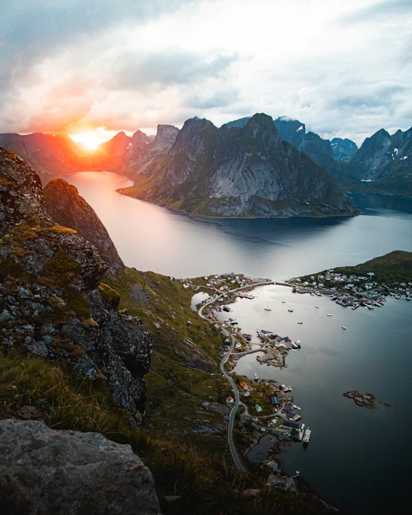 Calm water between steep coastal mountains in Norway under daylight