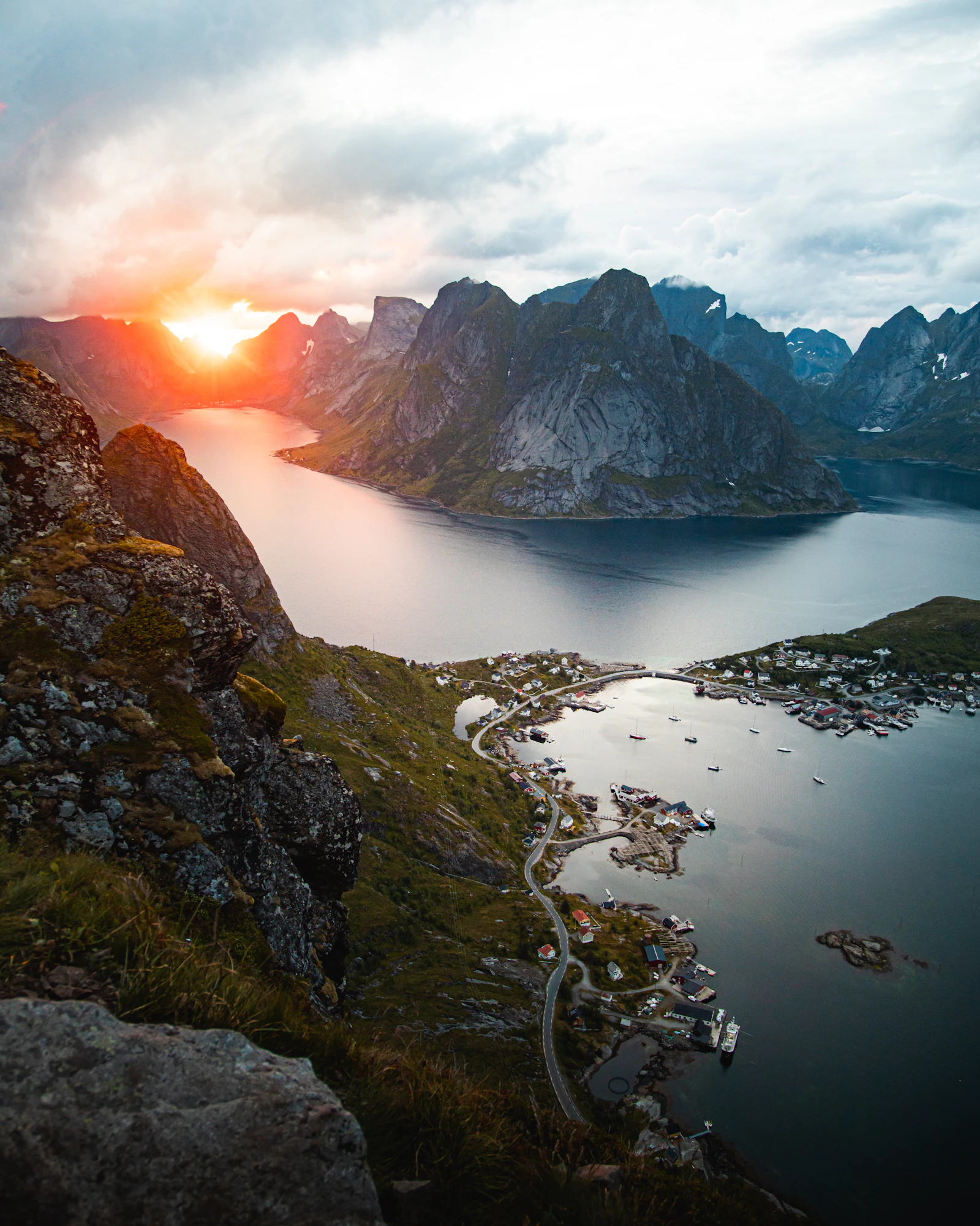 Calm water between steep coastal mountains in Norway under daylight