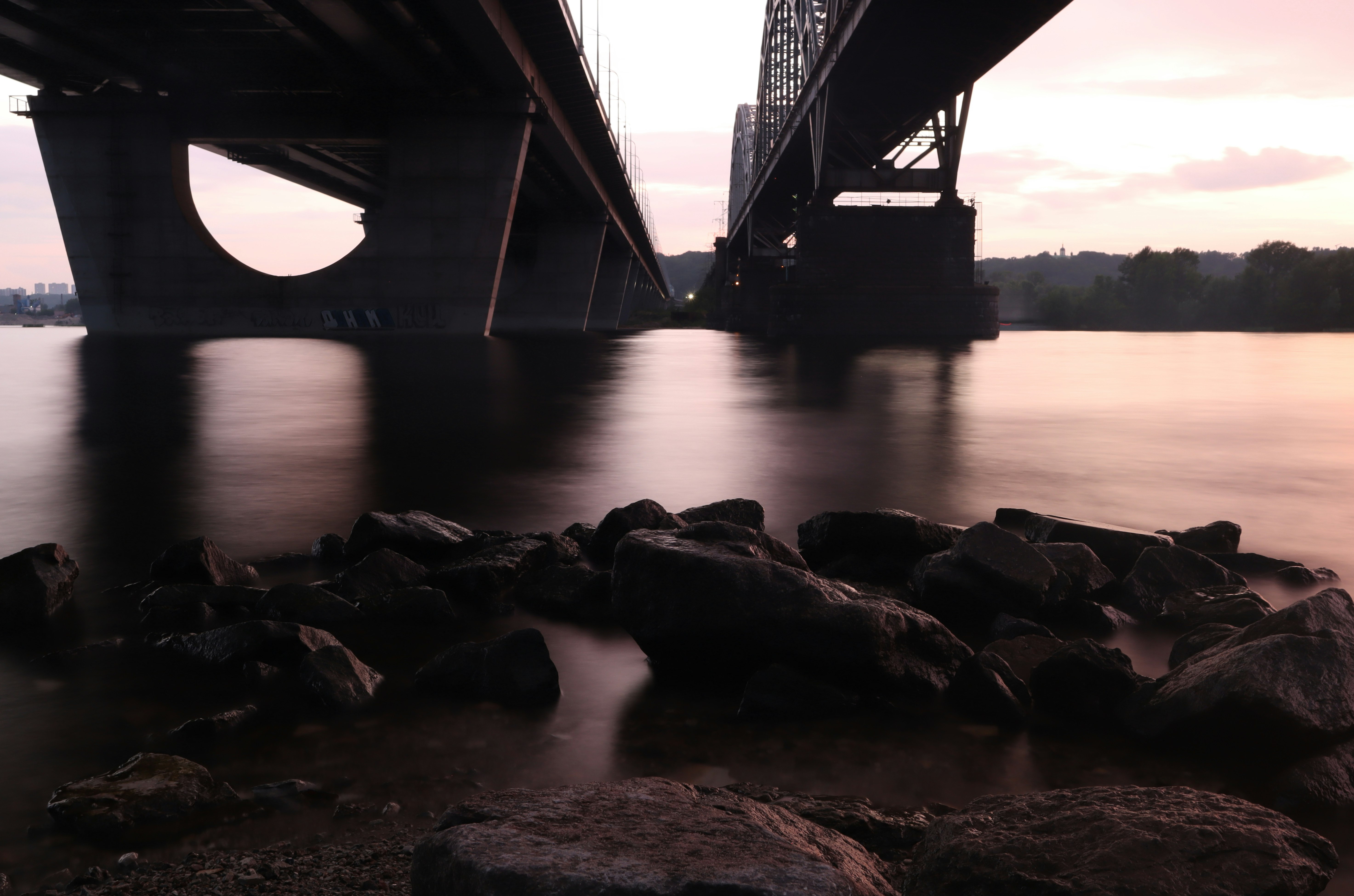 gray concrete bridge over body of water