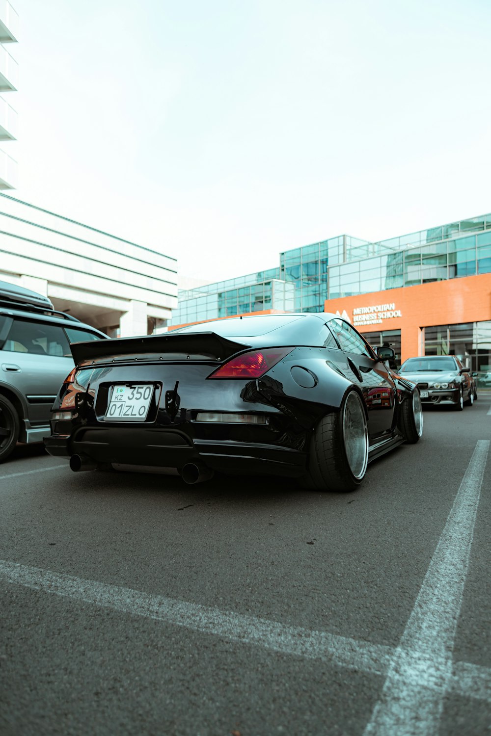 black bmw m 3 parked on parking lot during daytime