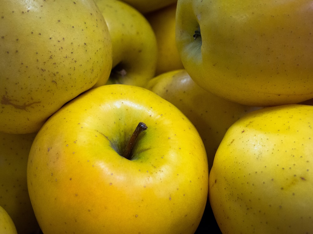 green apple fruit on yellow plastic container