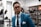 man in blue suit wearing black framed eyeglasses