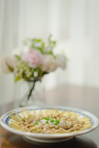 Close-up of a traditional Brazilian dish beautifully plated with fresh ingredients.