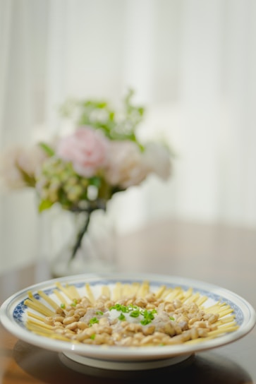 Elegant close-up of a traditional Ecuadorian dish beautifully plated on a minimalist white ceramic plate.