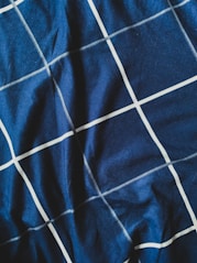 blue and white stripe textile