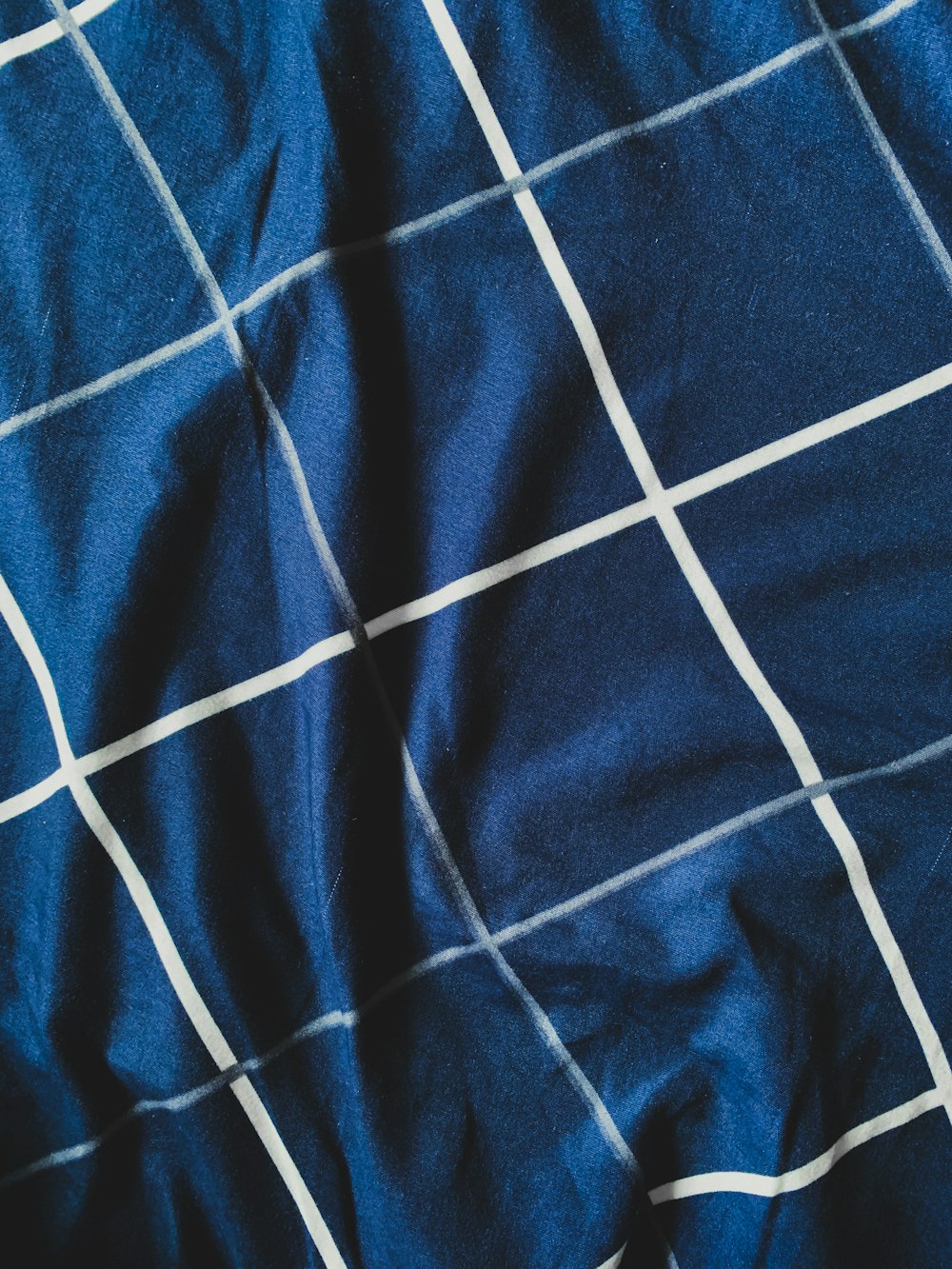 blue and white stripe textile