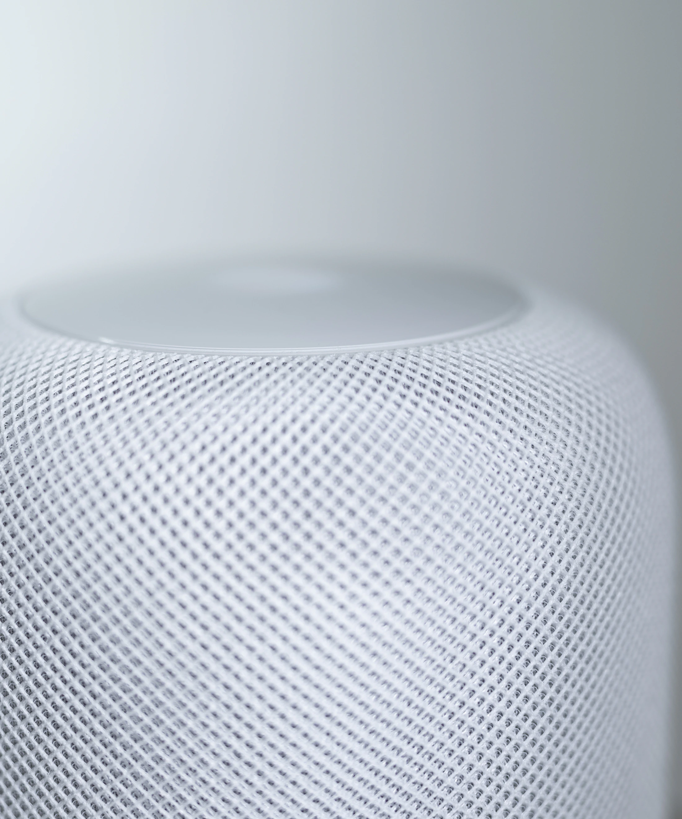 Minimal white smart speaker in close-up