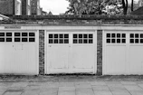 grayscale photo of wooden doors