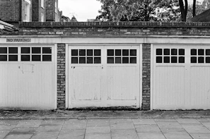 grayscale photo of wooden doors