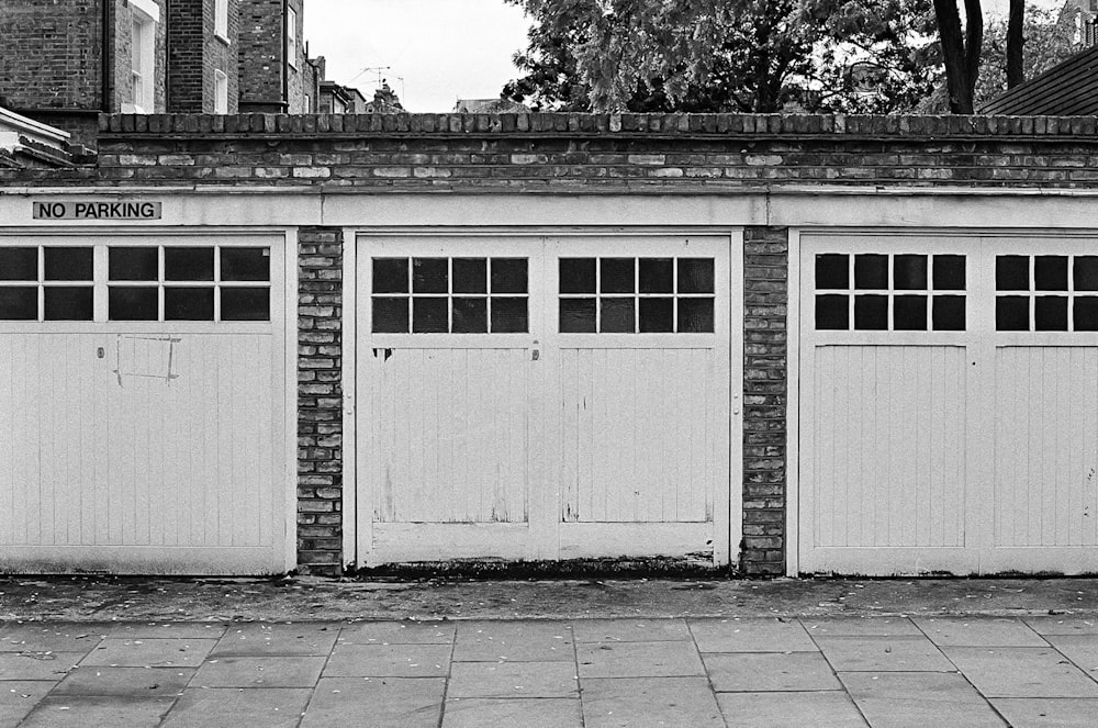 grayscale photo of wooden doors